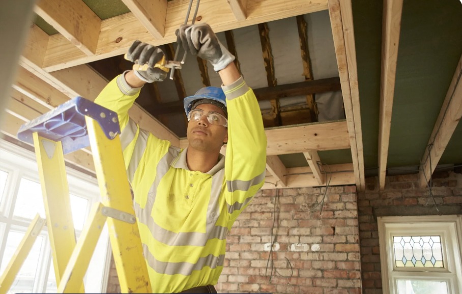 Electrician carrying out domestic rewiring